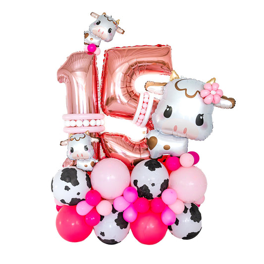 Pink cow birthday balloons Toronto custom cow-print arrangement by Wooow Balloons