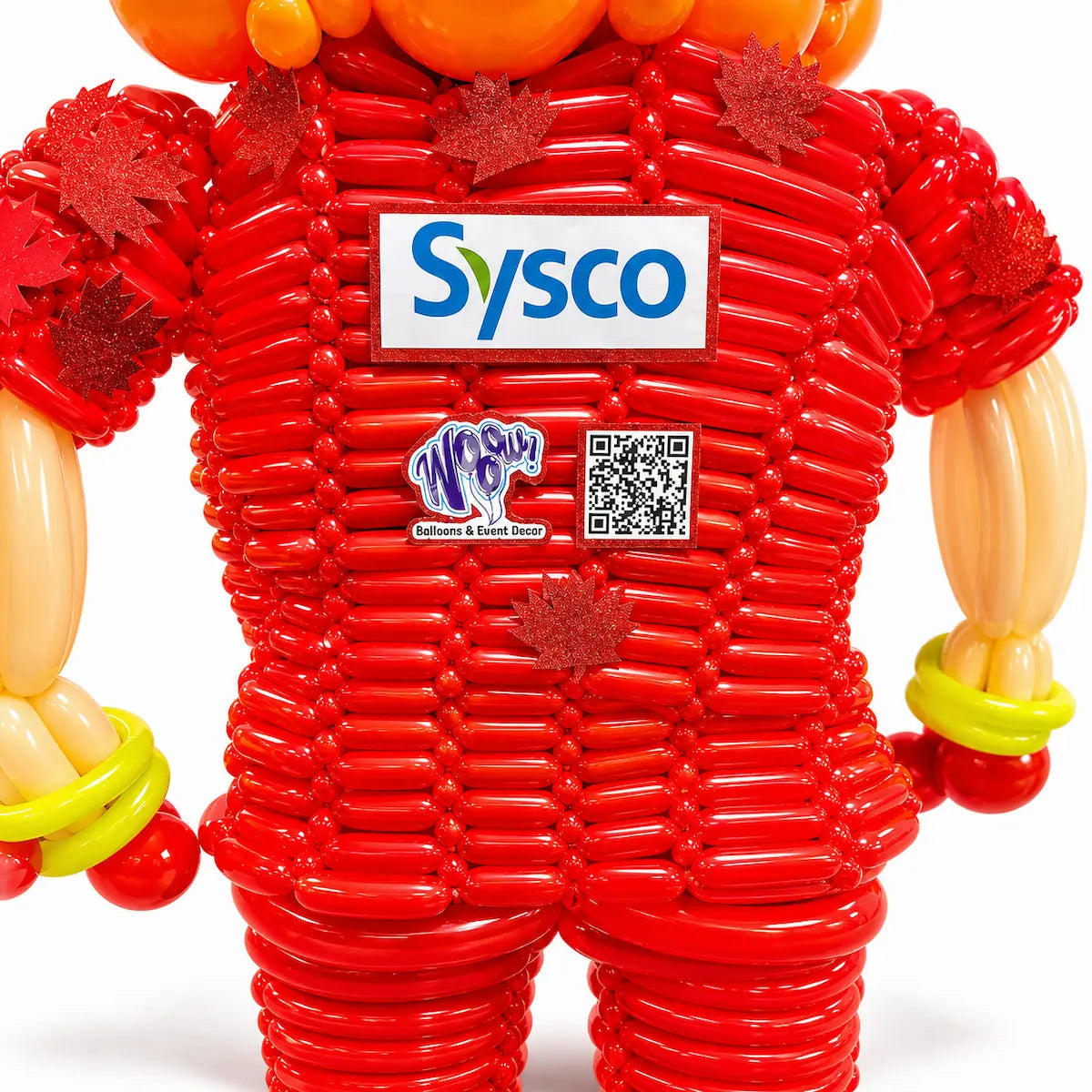 Close-up of a custom Sysco logo balloon sculpture with Canadian maple leaves by Wooow Balloons for corporate events in Toronto.
