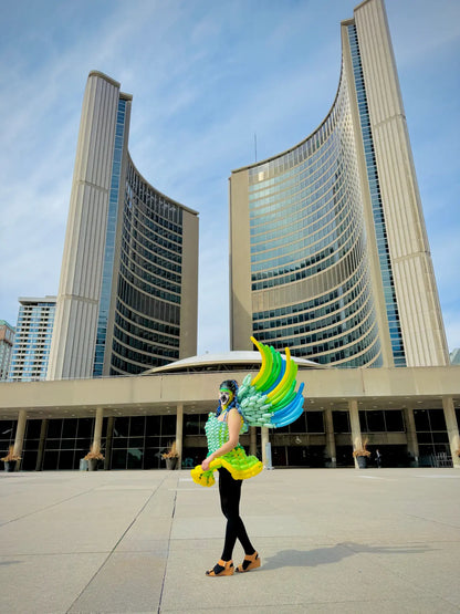 Custom green and blue winged balloon dress photographed at Toronto City Hall for creative events
