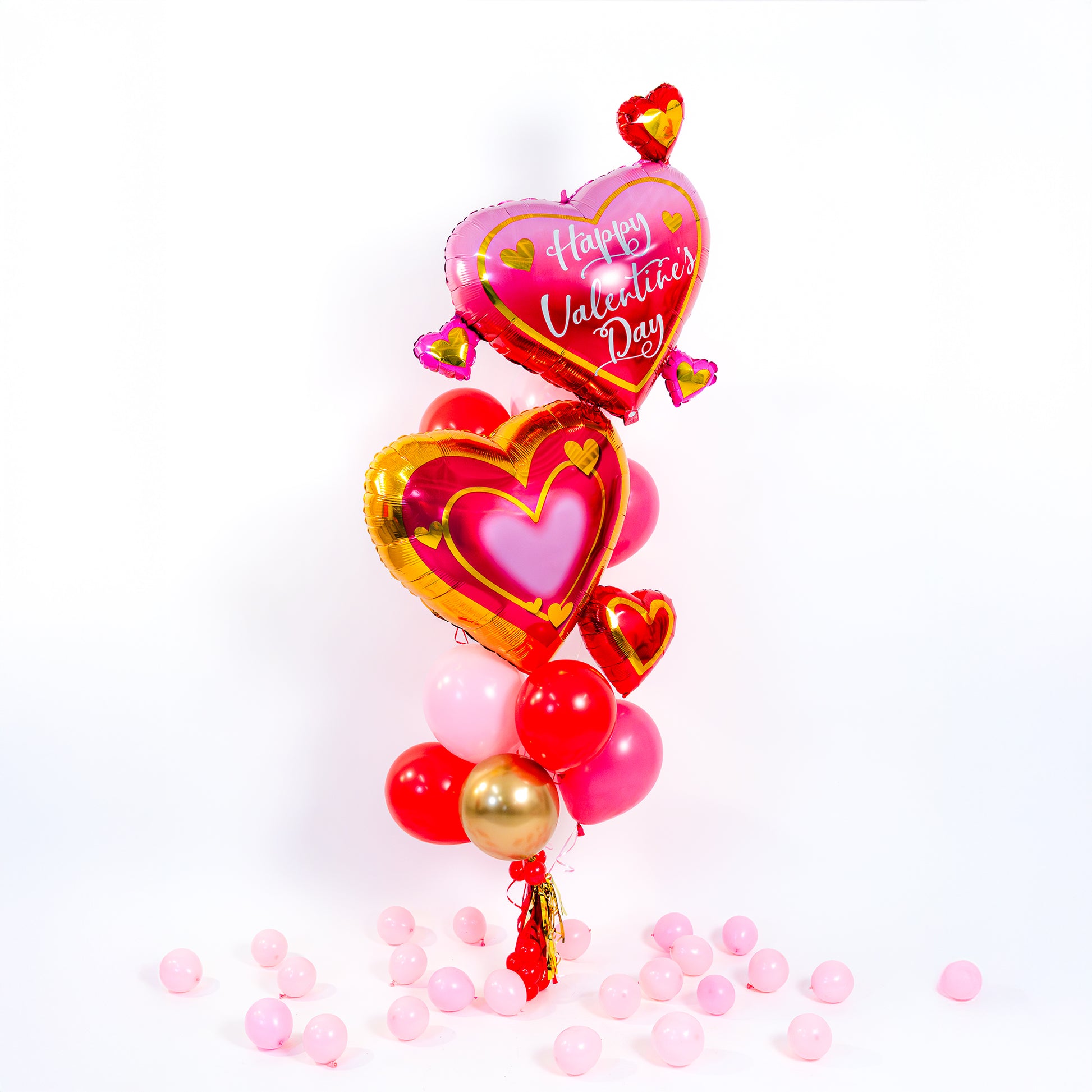 Double Heart Valentine Balloon Bouquet in Toronto with oversized heart balloons, pink red latex and tassels