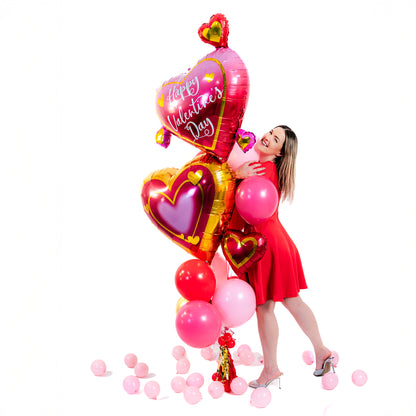 Wooow Balloons holding the Double Heart Valentine Balloon Bouquet – Valentine's Day balloons Toronto