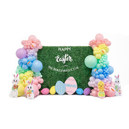 Luxury Easter balloon backdrop with pastel balloon garlands, green hedge wall, bunny and egg props, perfect for spring events, photo booths, and Easter party decor in Toronto and GTA.