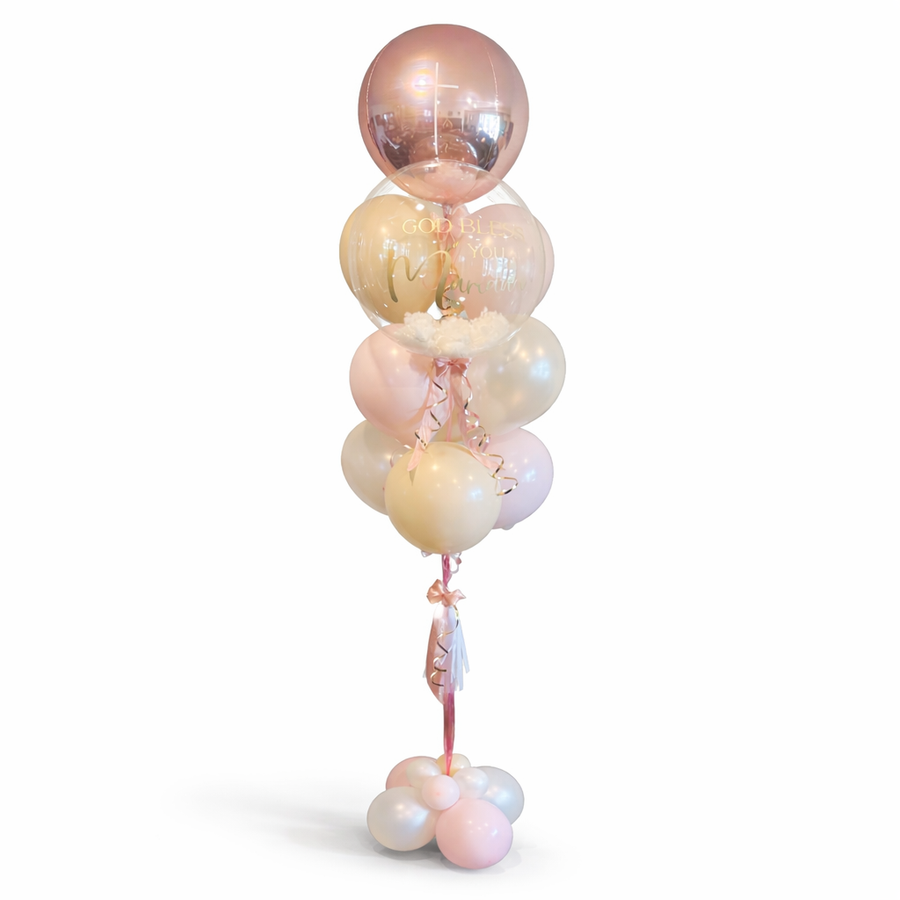 God Bless balloon arrangement with pastel balloons and personalized bubble balloon, elegant helium bouquet for baptism or religious celebration, Toronto same-day delivery