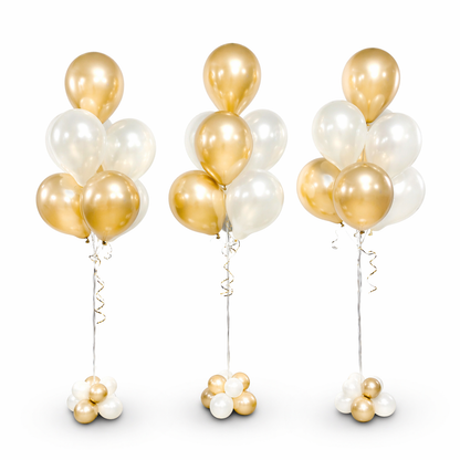 Set of three gold and white helium balloon bouquets with base clusters, elegant balloon decor for events and celebrations in Toronto