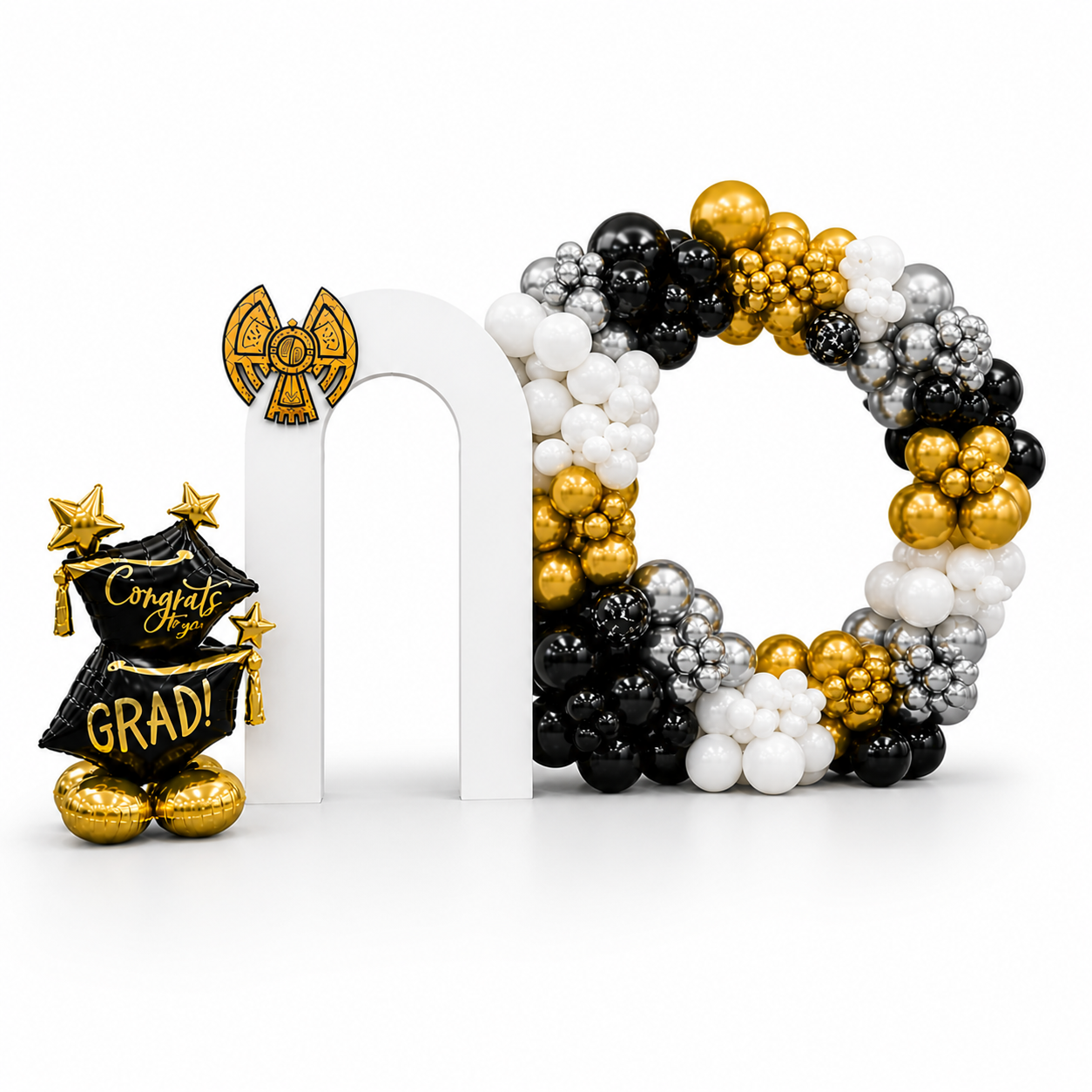 Graduation balloon backdrop with black, gold and white balloon arch and modern white panels, luxury grad party decor setup in Toronto for events, ceremonies and celebrations