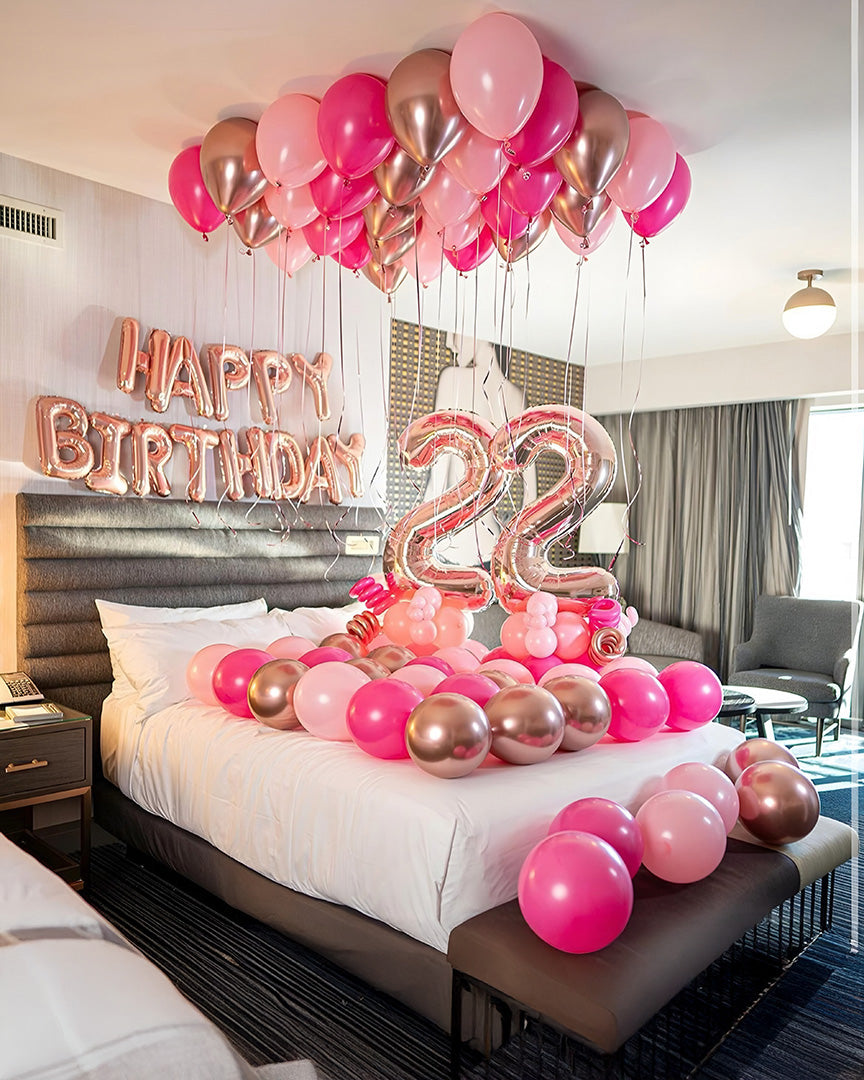 Happy Birthday Girl hotel room decor Toronto – pink and rose gold balloon setup with number balloons and ceiling balloons by Wooow Balloons