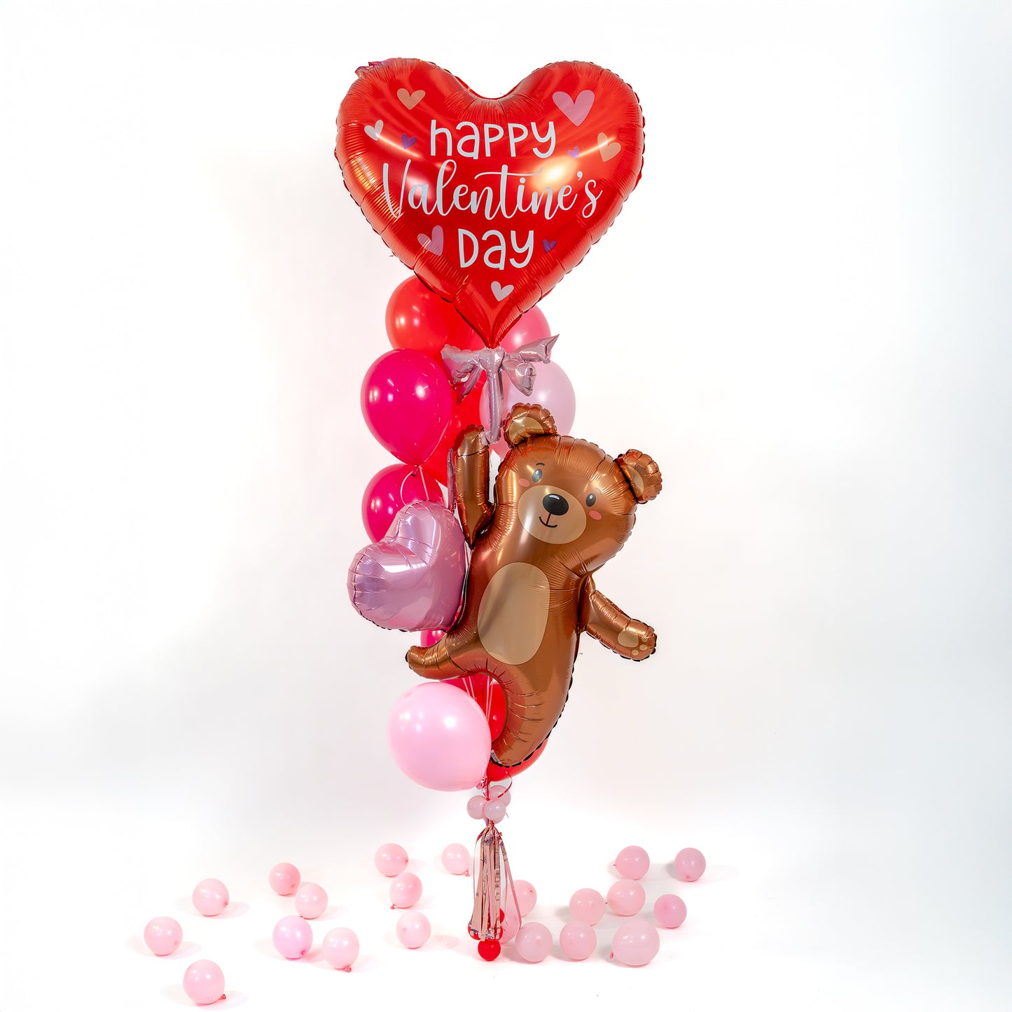 Helium Valentine’s Day balloons Toronto with teddy bear supershape, heart supershape, and handmade tassels