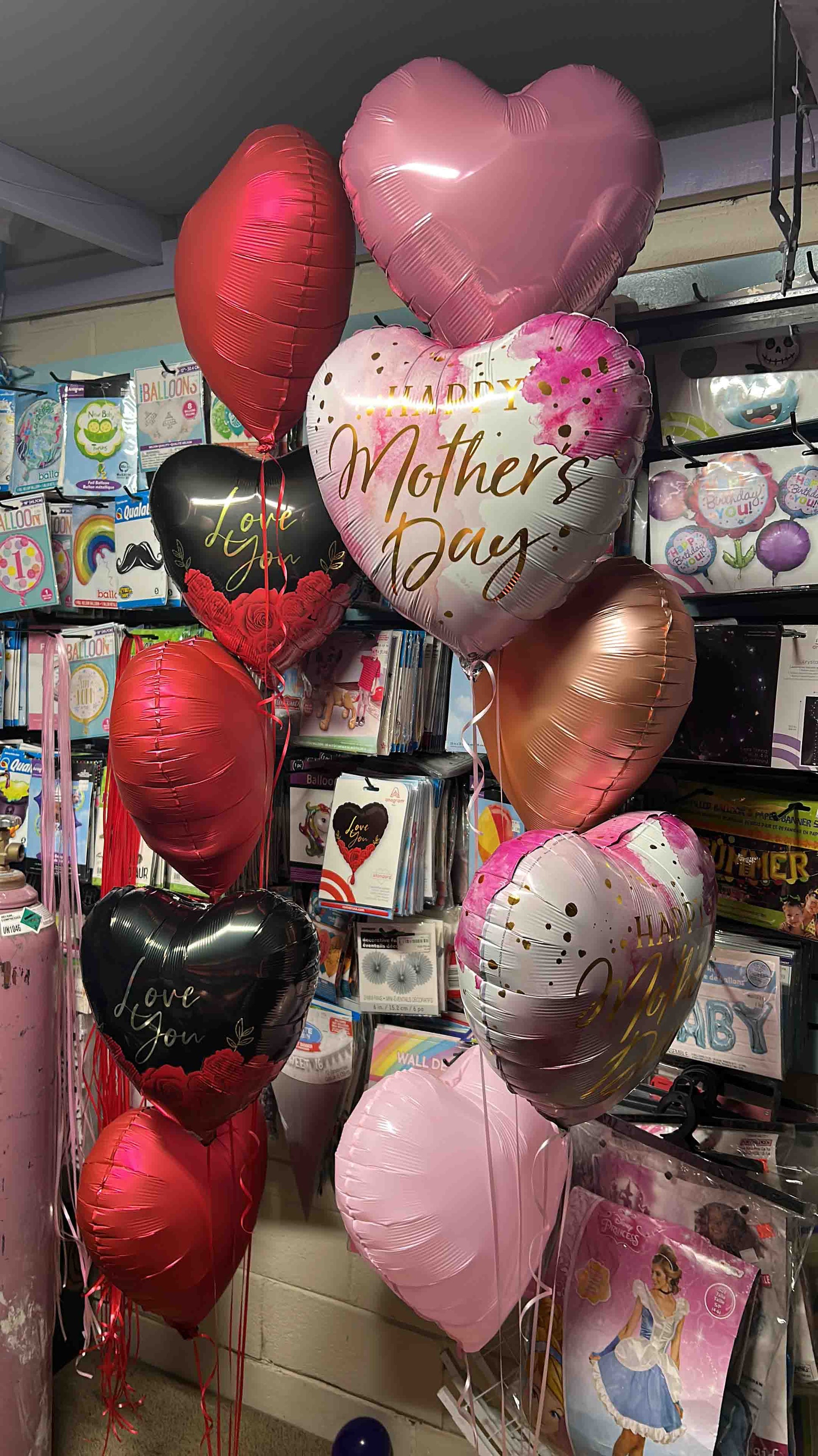 Heart-shaped balloons inside surprise gift box Toronto – Mother's Day and love-themed balloon arrangement by Wooow Balloons