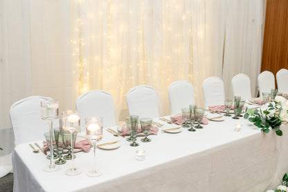 Elegant wedding decor including floral arrangements, centerpieces, and lighting installations by Wooow Balloons.