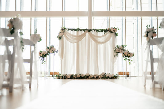 Elegant wedding decor including floral arrangements, centerpieces, and lighting installations by Wooow Balloons.