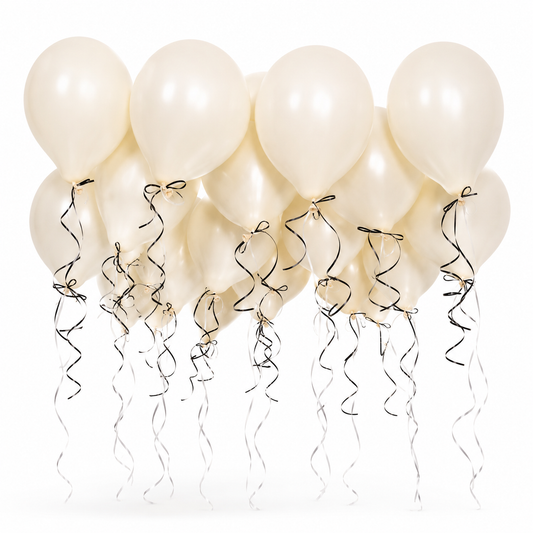 Elegant ivory ceiling balloons with black and white curling ribbons for luxury birthday parties, weddings, and event decor in Toronto by Wooow Balloons.