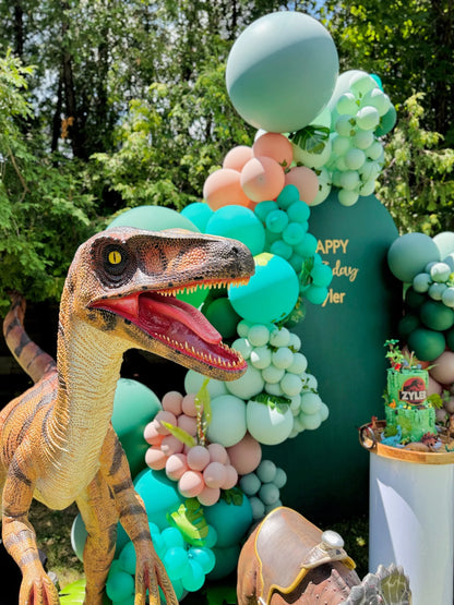 Realistic dinosaur props with jungle balloon garland – Toronto balloon decor