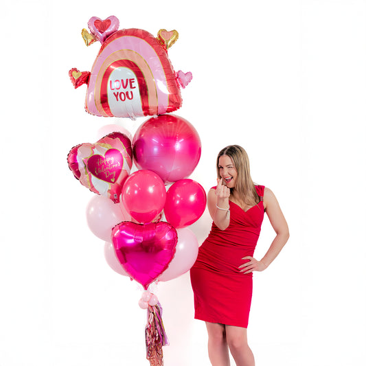 Love You Rainbow Valentine Balloon Bouquet (Toronto) with large rainbow heart foil balloon, heart balloons, latex balloons and tassel weight.