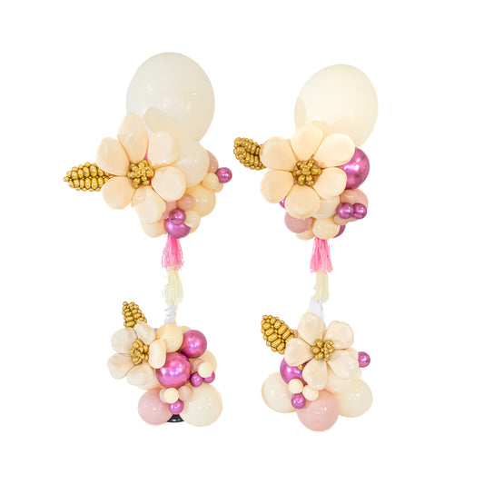 Luxury Balloon Entrance Toronto with two matching ivory floral arrangements and gold leaves by Wooow Balloons