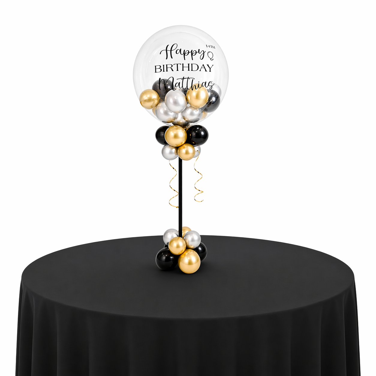 Luxury personalized birthday balloon centerpiece in black, gold, and silver displayed on round table with black linen for elegant event decor in Toronto.