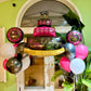 Luxury birthday cake balloon arch Toronto – Pink, gold, and black helium balloons with large cake balloon centerpiece by Wooow Balloons Toronto