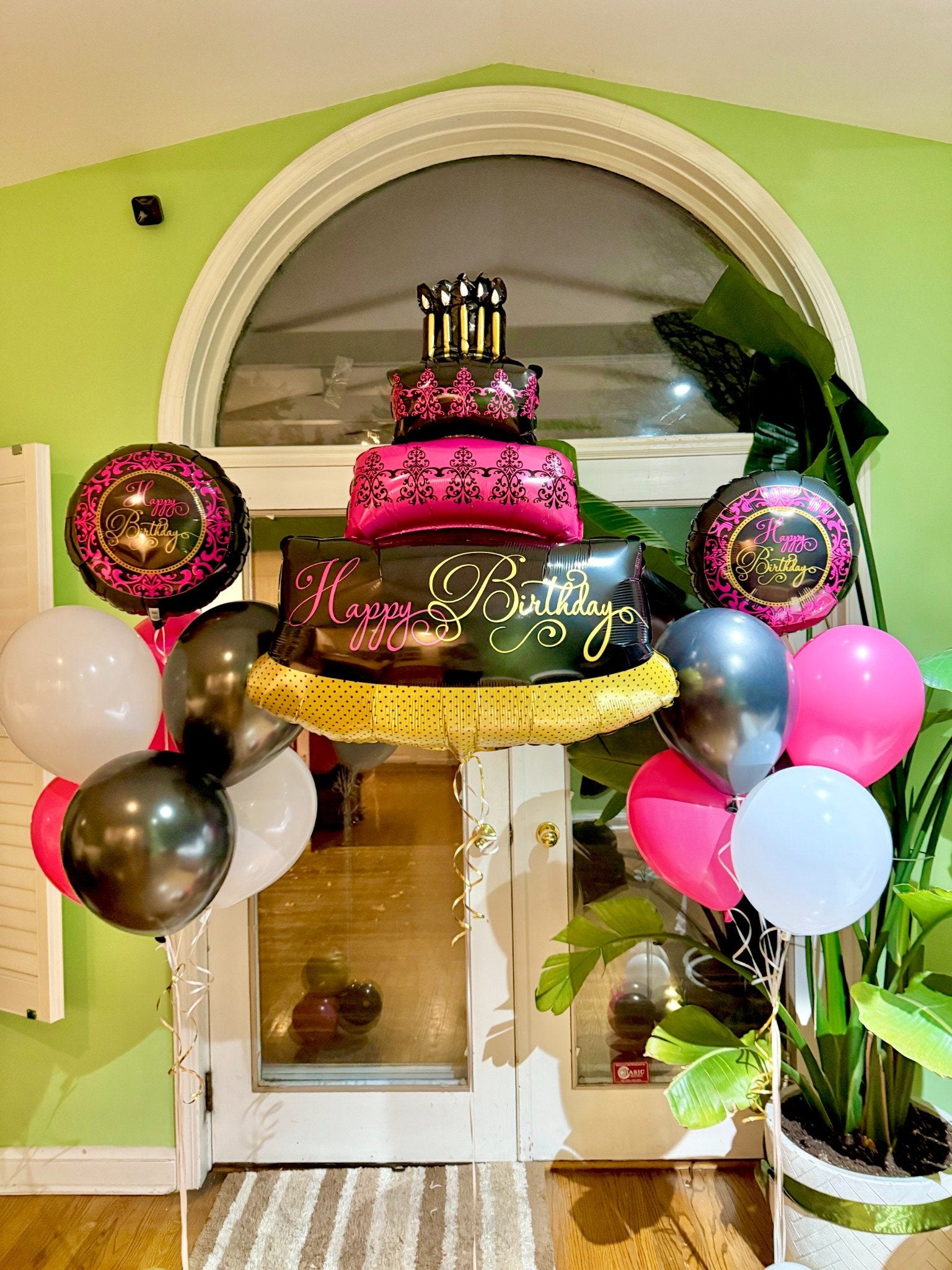 Luxury birthday cake balloon arch Toronto – Pink, gold, and black helium balloons with large cake balloon centerpiece by Wooow Balloons Toronto
