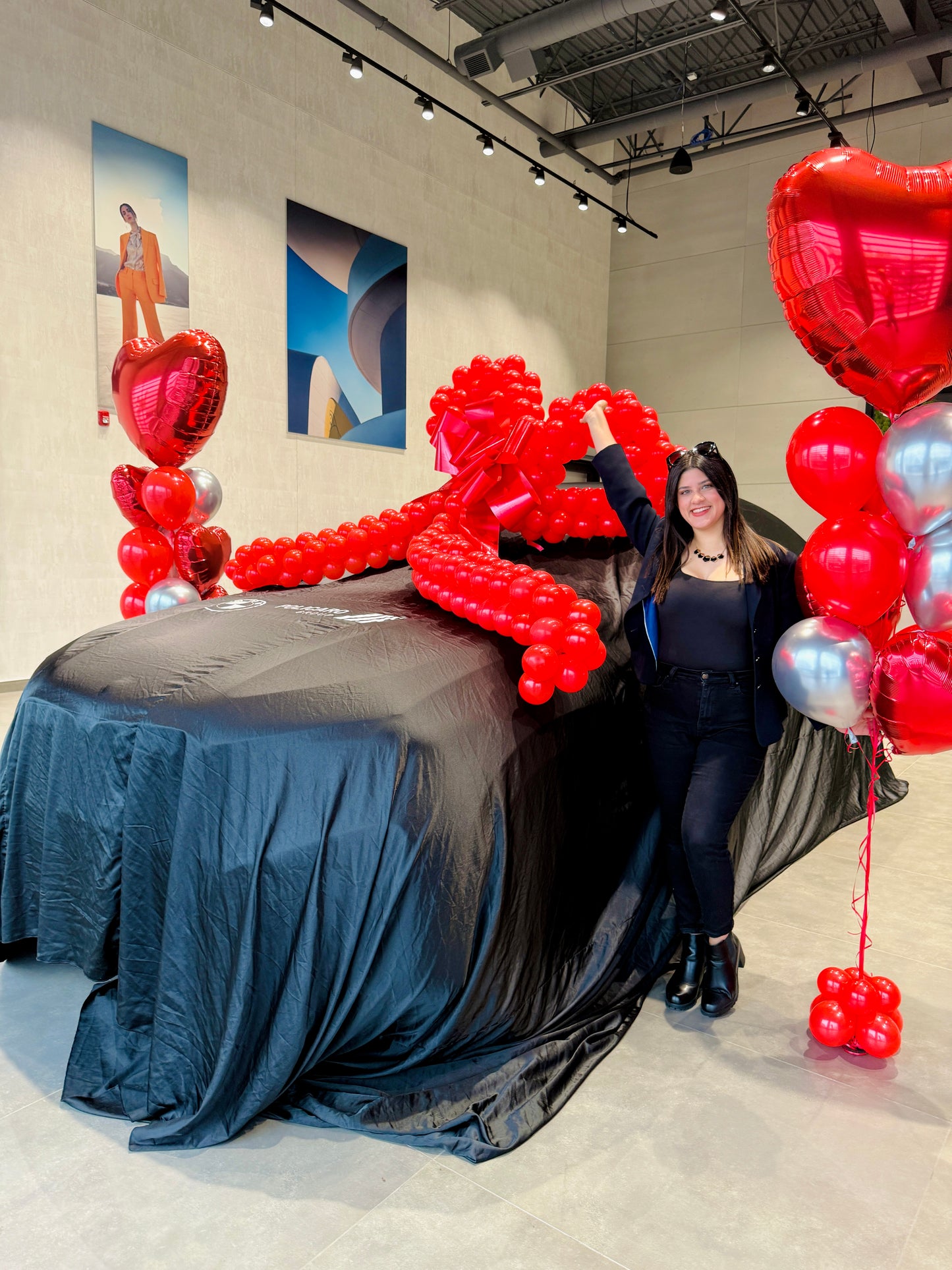 Luxury Car Reveal Balloon Package at Toronto dealership with red heart balloons