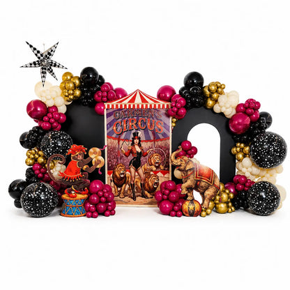 Luxury circus balloon backdrop with black, magenta, gold and ivory garlands and custom animal props in Toronto.
