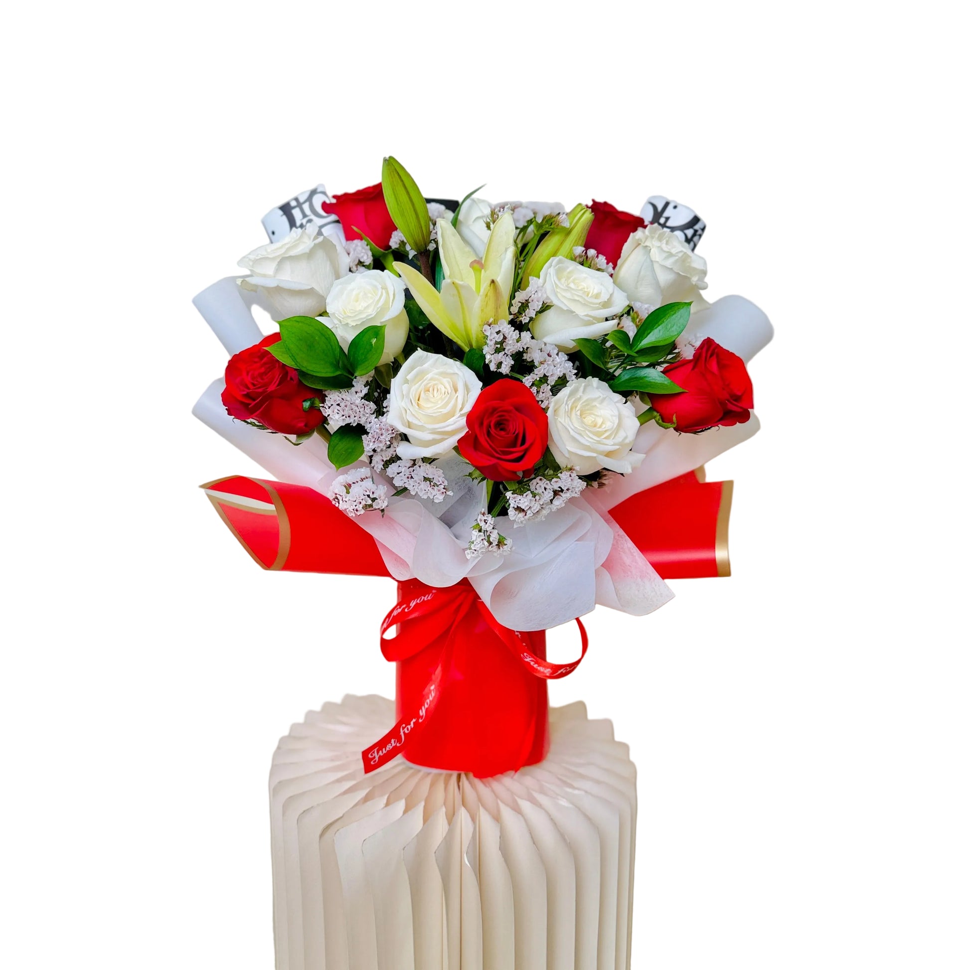 Elegant red and white Mother’s Day floral arrangement with lilies and roses