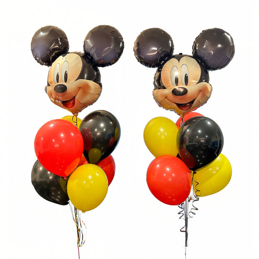Two Mickey Mouse balloon bouquets with red, yellow and black balloons
