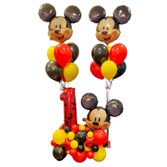 Mickey Mouse first birthday balloon package with two character bouquets and a red number 1 balloon stand