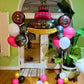 Modern black, white, and pink birthday balloon setup Toronto – Elegant helium balloon columns and cake balloon