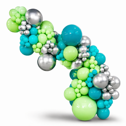 Modern organic balloon garland in green, teal blue, and metallic silver tones with mixed balloon sizes, designed for elegant event decor and installations in Toronto
