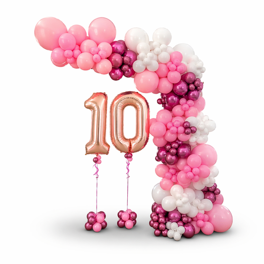Pink balloon garland with custom number balloons, elegant birthday backdrop and balloon decor setup in Toronto
