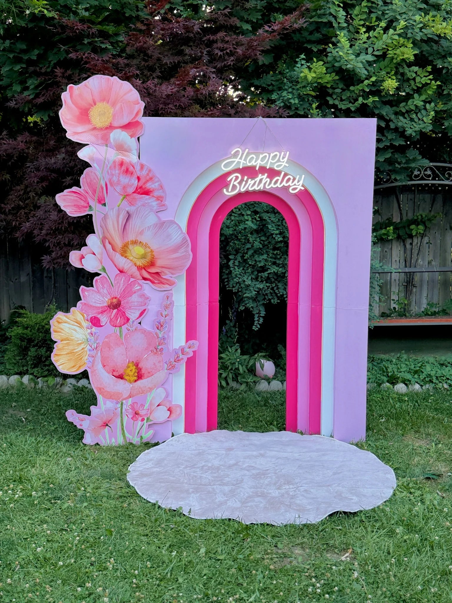 Pink rainbow backdrop with 3D flowers and Happy Birthday sign – perfect for birthday parties and photo setups in Toronto by Wooow Balloons.