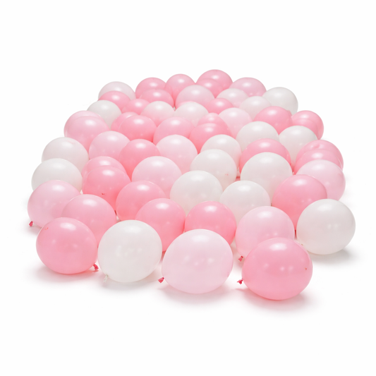Pink and white latex balloons scattered on floor, elegant balloon decor setup for birthdays and events in Toronto with soft luxury styling