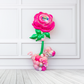 Giant pink flower balloon stand with heart balloon and latex balloons, helium-filled top and air-filled base