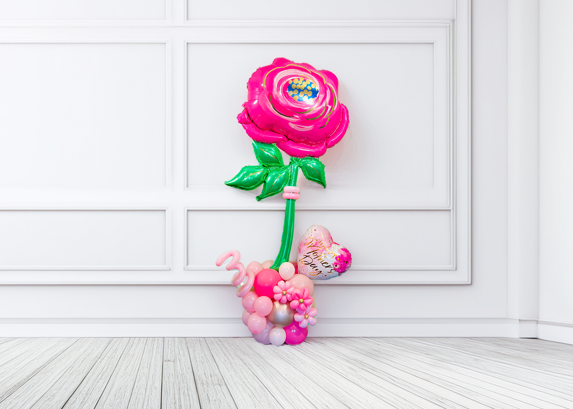 Giant pink flower balloon stand with heart balloon and latex balloons, helium-filled top and air-filled base