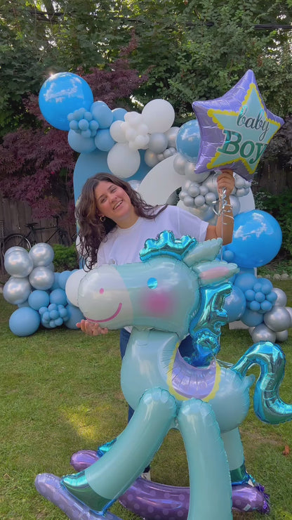 New Baby Born Balloon Decor setup with blue and silver balloons and a rocking horse balloon in Toronto