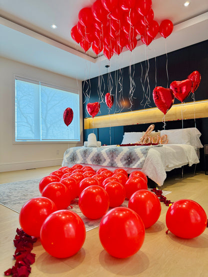 Proposal and anniversary room setup with balloons hearts petals and LED candles in the GTA