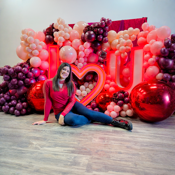 Proposal balloon setup in Toronto with I Love You LED marquee letters, luxury balloon wall, and mirror ball accents