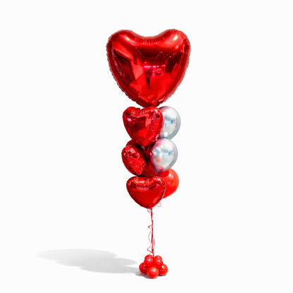 Luxury red heart balloon bouquet with silver balloons for Valentine’s Day, romantic balloon arrangement Toronto, helium balloon delivery GTA, love themed balloon bouquet for anniversary or birthday