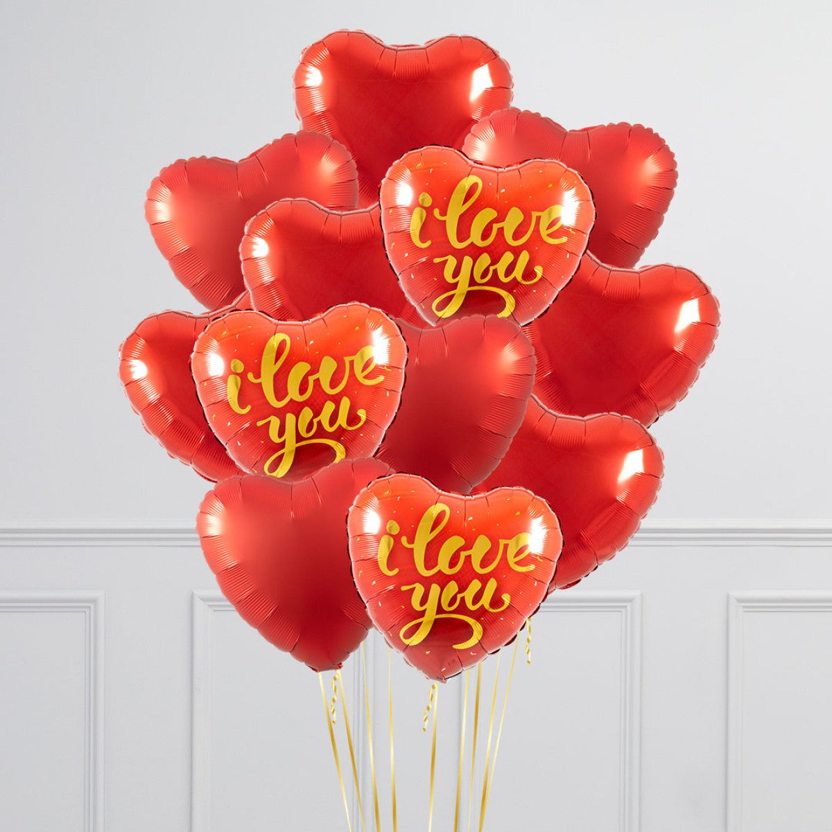 Valentine's Day Balloons dozen in Toronto with red helium heart balloons featuring I Love You design