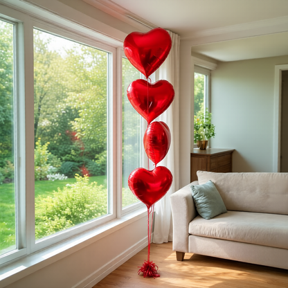 Red Heart Balloons Toronto arranged as a heart balloon bouquet with helium and balloon weight.