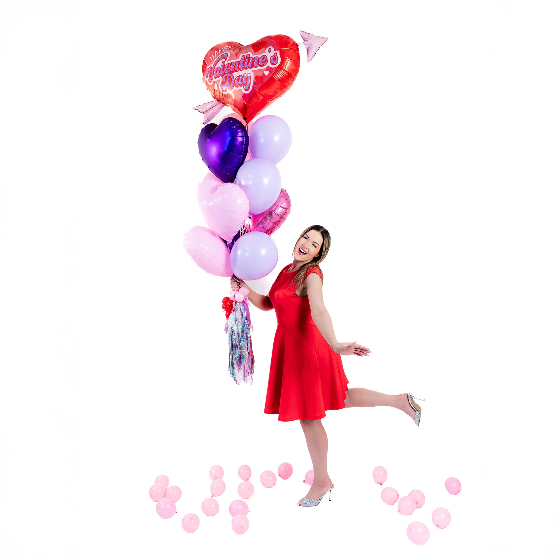 Wooow Balloons holding the Retro Cupid Heart Balloon Bouquet – Valentine's Day balloons Toronto