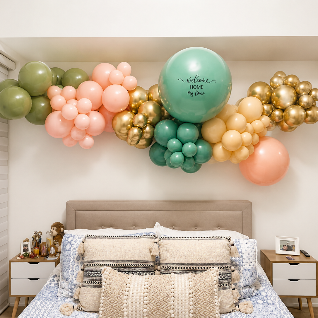 Romantic bedroom balloon surprise featuring custom welcome home balloons and luxury organic balloon decor above the bed in Toronto.