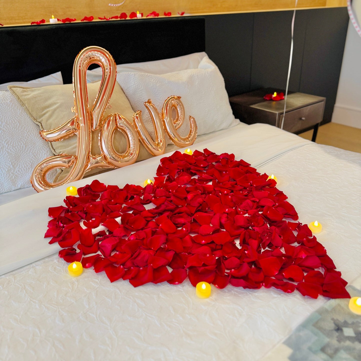 Romantic hotel room balloon setup with red floor and ceiling balloons for a Toronto surprise