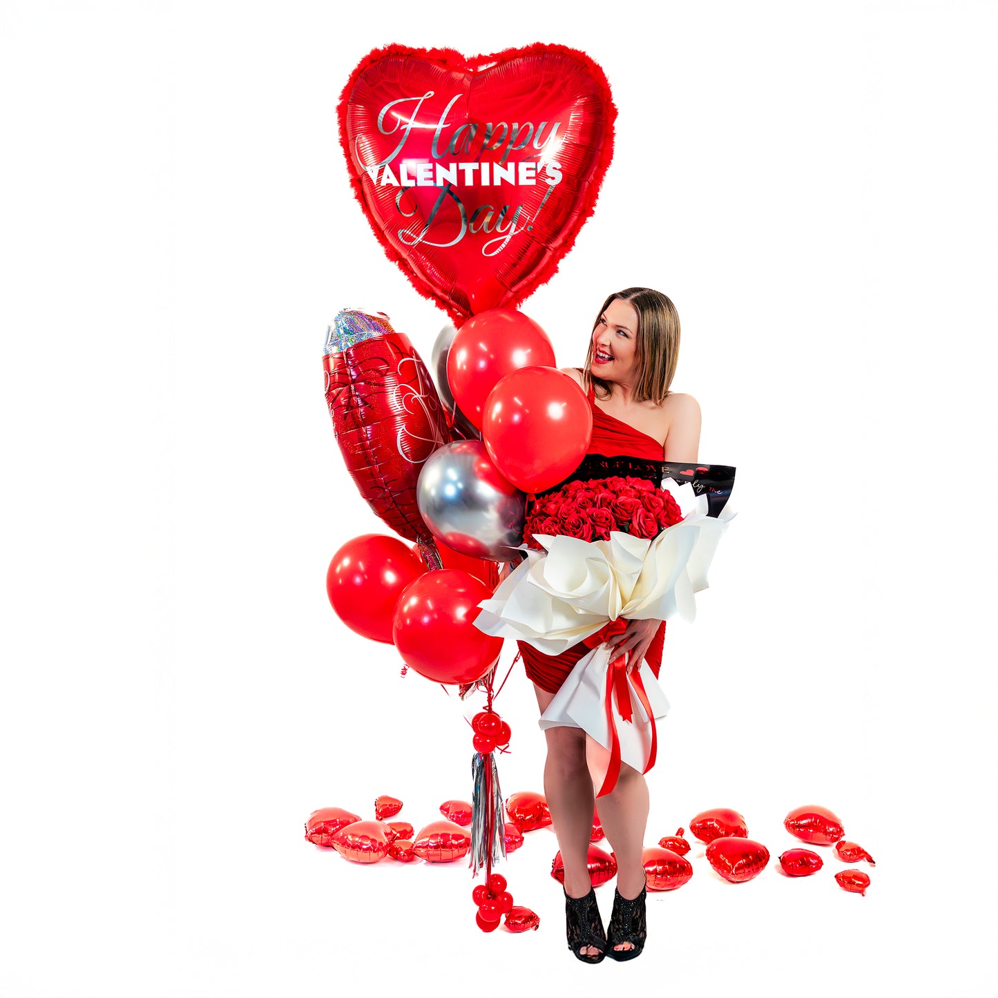Model posing with a romantic Valentine balloon bouquet, photo-ready for a surprise setup