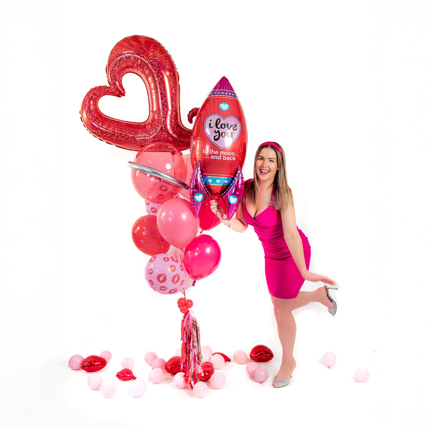 Same-day Valentines balloons Toronto featuring “to the moon and back” rocket balloon with red heart foil balloon and pink latex balloons.