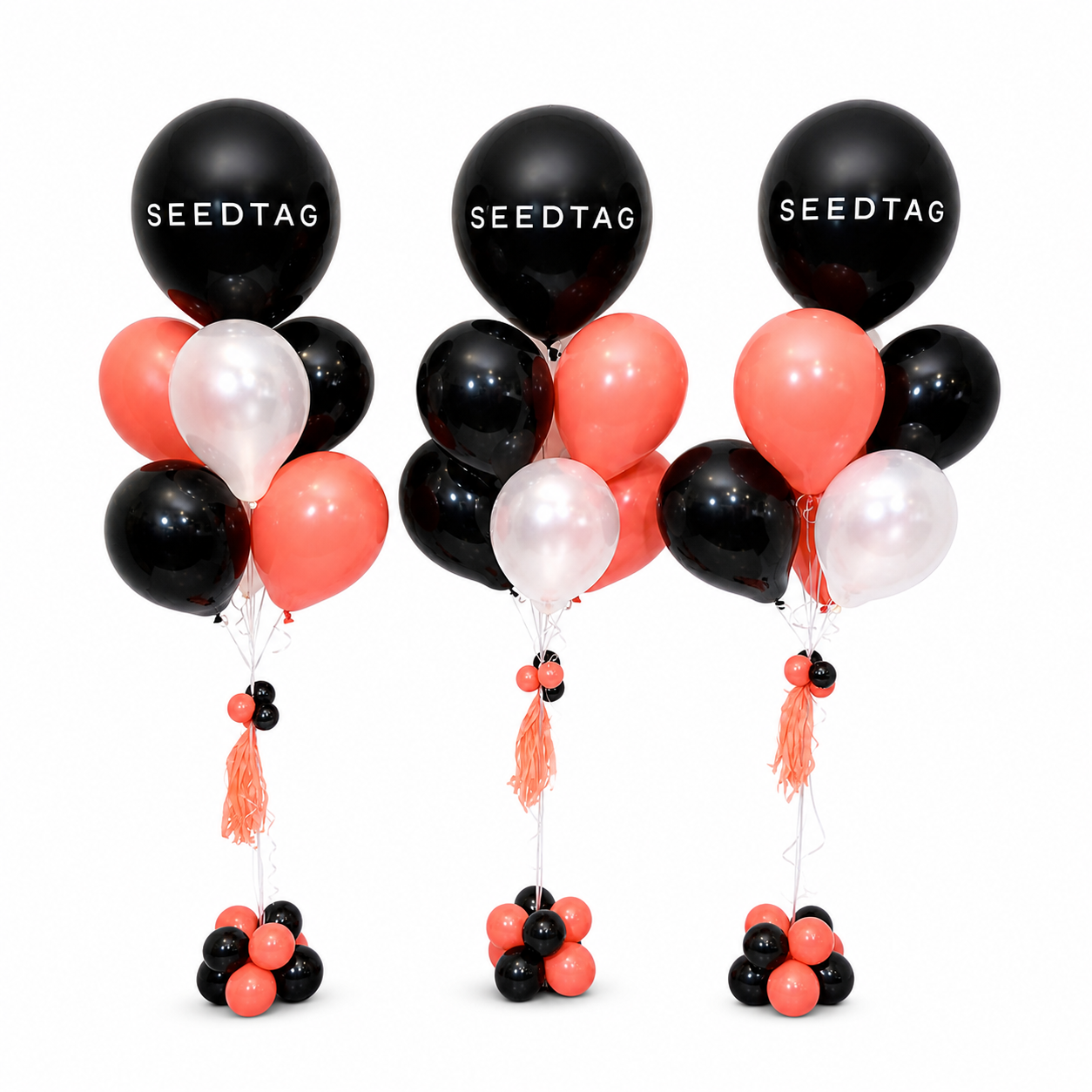 Seedtag branded balloon bouquets in black, coral and white for corporate balloon decor and events in Toronto by Wooow Balloons