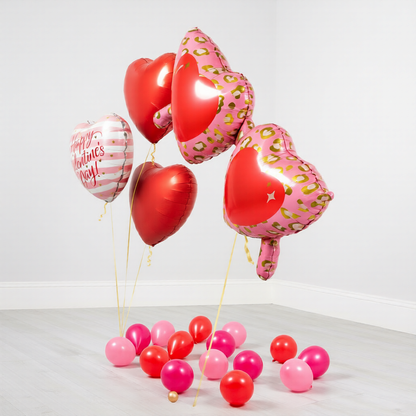 Valentines balloons Toronto arrangement featuring a fun glasses supershape and red heart balloons, delivered fully inflated with helium