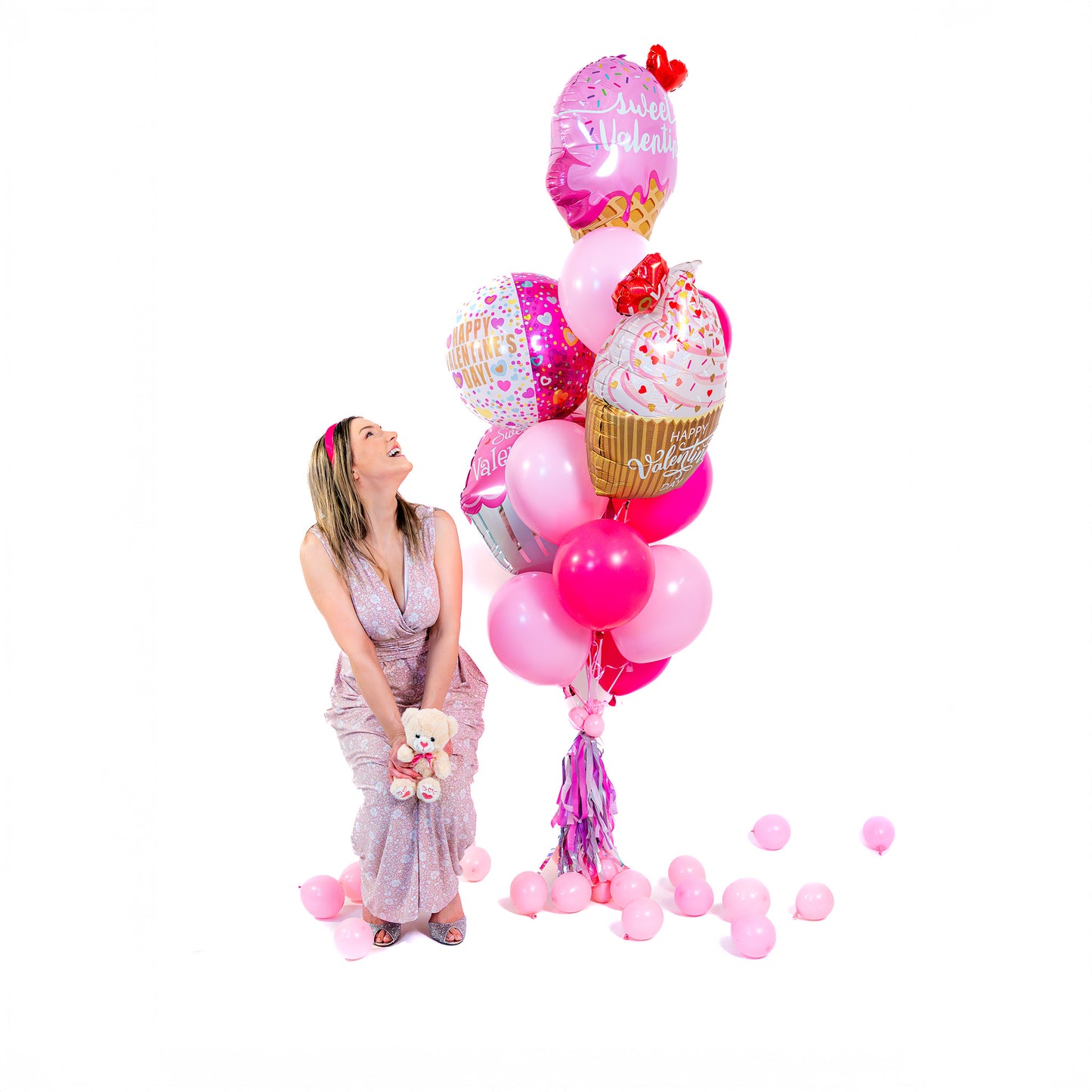 Sweet Valentine balloon bouquet Toronto with four supershape balloons and Valentine latex balloons, helium-filled.
