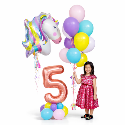 Unicorn 5th birthday balloon bouquet with rose gold number 5 and pastel balloons Toronto, child holding balloons celebration setup