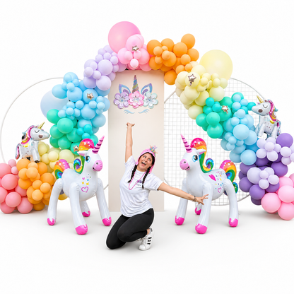 Rainbow unicorn balloon arch with pastel balloons and unicorn decor for birthday party setup in Toronto, luxury kids party balloon decoration with organic garland and backdrop