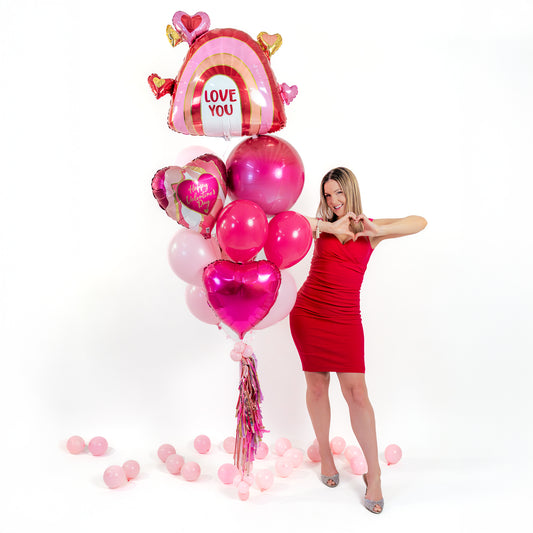 Detail of Valentines balloons Toronto showing the “Love You” rainbow heart foil balloon and Valentine heart foil balloons.